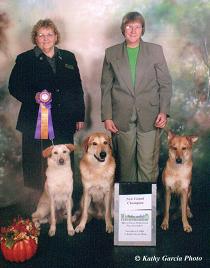 Electra's Grand Champion picture with 
her son, NBOB GR CH 'PR' Hurricane Janecek and granddaughter, NBOB 
GR CH 'PR' Mystic's Hurricane Sydney sitting to Electra's right.  Also 
standing in the picture are the 
Honorable Beth Snedegar, who awarded Electra her 5th point; and Joyce 
A. Maley, breeder/owner/handler of Electra.